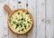 Vegetable pie quiche with broccoli and soft cheese over white