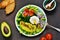 Vegetable plate with salad, onion, tomatoes, avocado and egg