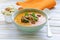 Vegetable pumpkin cream soup with walnuts