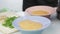 Vegetable puree soup pours into plate
