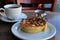 Vegetable quiche and hot cup of coffee