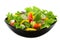 Vegetable salad in black square plate