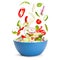 Vegetable salad in levitation. Fresh vegetarian salad of cucumbers, cabbage, cherry tomatoes, onions, peppers, spinach