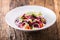 Vegetable salad. Plate of salad with vegetables on rustic oak table. Assortment of ingredients of vegetable salad