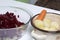 Vegetable salad. Russian recipes. Cooking Stages. Pickled cucumbers and beetroot crumble in a single container. Peeled potatoes c