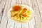 Vegetable samosa with spices, iceberg lettuce, tomato and dip sauce