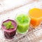 Vegetable smoothies beet, carrot, cucumber, top view square selective focus