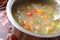 Vegetable soup in a bowl made of beans, carrots and tomato