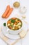 Vegetable soup meal with vegetables and baguette