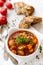 Vegetable stew with peppers, zucchini, beans and tomatoes with aromatic herbs