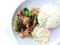 Vegetable stir-fry dish with Thai healthy food stir-fried broccoli, mushroom, carrot, hearb, squid and shrimp with rice and fried