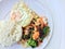 Vegetable stir-fry dish with Thai healthy food stir-fried broccoli, mushroom, carrot, hearb, squid and shrimp with rice and fried