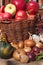 Vegetables and apples in a basket. Autumn day in the home garden. Healthy food for diet. Sunny day.