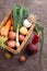 Vegetables in a basket: beets, onions, garlic, dill, potatoes, carrots