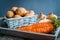 Vegetables in a basket: beets, onions, garlic, dill, potatoes, carrots on an old wooden background