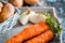 Vegetables in a basket: beets, onions, garlic, dill, potatoes, carrots on an old wooden background