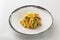 Vegetables in a batter in a plate isolated on a white background