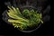 Vegetables boiled in a black bowl