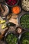 Vegetables in a bowl, chickpeas, avocado halves on the table