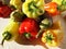 Vegetables bright, colorful, contrasting Bulgarian sweet red and green peppers and eggplant in water drops are a bunch on a white