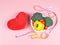 Vegetables  capsicum, broccoli and tomato in heart shape plate, measuring tape and red heart shape pillow on pink background.
