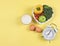 Vegetables  capsicum, broccoli, tomatoes and apple  in heart shape plate, white  vintage alarm clock, a glass of milk  and eggs on