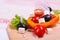 Vegetables, cheese and olives on the kitchen blackboard