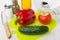 Vegetables on cutting board, bowl, vegetable oil, salt, spices,