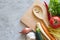 Vegetables, cutting board and smiling spoon on concrete background. Healthy eating