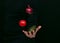 Vegetables fall to the cooks hand, vegetables soar in the air on a dark background