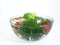 Vegetables and fruits in a clear bowl; 1 of 5