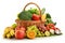 Vegetables and fruits in wicker basket isolated