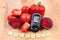 Vegetables, glucometer and polish word diabetes on wooden surface, healthy lifestyle and nutrition