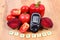 Vegetables, glucometer and word diabetes on wooden surface, healthy lifestyle and nutrition