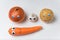 Vegetables with Googly eyes on white background. Onions, garlic, potatoes, carrot with funny faces