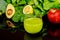 Vegetables healty smoothie in glass on black table