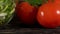 Vegetables ingridients for salad on rustic wooden background.