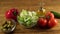 Vegetables ingridients for salad on rustic wooden background.