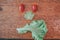 Vegetables made angry face on a cutting board on a light wooden table Tomatoes, lettuce,knife.