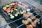 Vegetables and meat on grill. Pepper, tomatoes, mushrooms and zucchini squash. Chicken on open fire. Summer barbecue party.