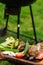 Vegetables near the grill. Green grilling. Preparing to cook healthy vegan food on fire. Fresh artichoke, tomato, pepper and