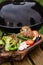 Vegetables near the grill. Green grilling. Preparing to cook healthy vegan food on fire. Fresh artichoke, tomato, pepper and