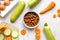 Vegetables and petfood on kitchen table background top view