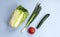 Vegetables for salad, top view: cabbage, onions, tomato, cucumber