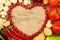 Vegetables shape of a heart on wooden background, vegetarian food. A healthy diet