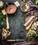 Vegetables soup cooking preparation with parsnip and leek on rustic kitchen table background with ingredients, pot , vegetable bro