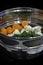 Vegetables in a stainless steel steamer prepared to be cooked