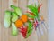 Vegetables and syringe on wooden table