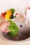 Vegetables washing in a kitchen.