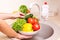 Vegetables washing in a kitchen